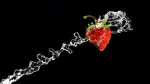 benefits of drinking water image of a strawberry which is high in water content 